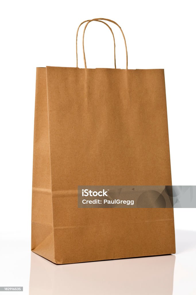 Brown paper shopping bag. An eco friendly brown paper shopping bag on white background.Here are similar images. Brown Stock Photo