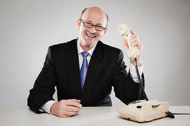 istock Happy businessman with telephone receiver 182916697