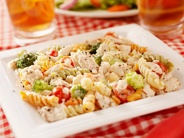 Pasta Salad with Tuna and Fresh Vegetables "Pasta Salad with Tuna, Fresh Vegetables and Iced Tea-Photographed on Hasselblad H3D2-39mb Camera" seafood salad stock pictures, royalty-free photos & images