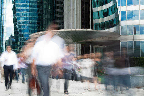 istock Blurred Business Commuters Walking in Financial District 182916910