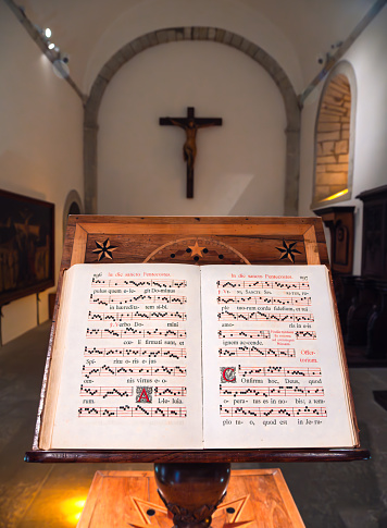 Grande Chartreuse, France - September 30, 2023: Vintage hymnal of Gregorian chants with sheet music