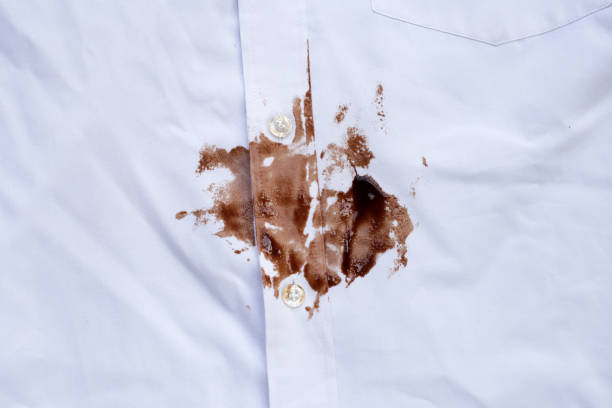 istock Dirty choclate stain on white shirt 1829173656