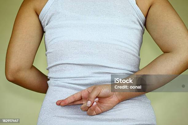 Fingers Crossed Behind Back Stock Photo - Download Image Now - Artificial, Athlete, Back