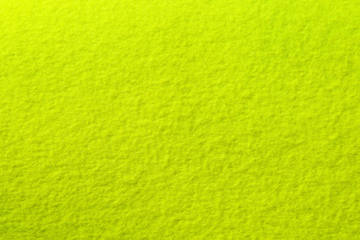 Tennis ball felt photographed flat as background. This is  Authentic felt used in the making of tennis balls.