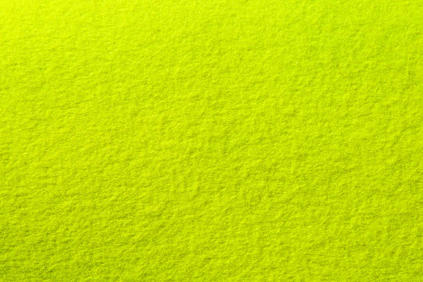 Extreme close-up Tennis ball background Tennis ball felt photographed flat as background. This is  Authentic felt used in the making of tennis balls. felt stock pictures, royalty-free photos & images