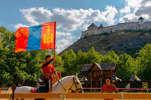 SUMEG, HUNGARY - AUGUST 9. 2022: Mongolian acrobat in the medieval horse military show in the Sumeg Fortress