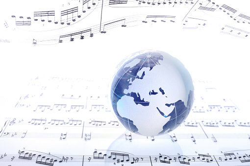 Blue globe on sheet music.(Sonate for Violin and Piano K 379. W.A.Mozart)