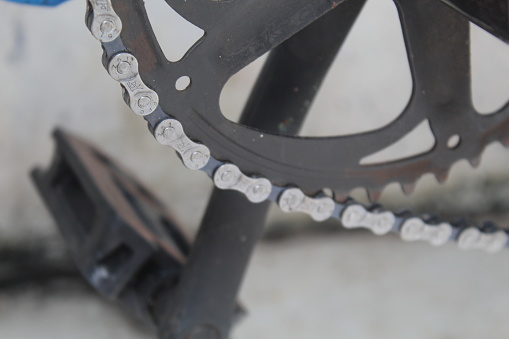 Close up of a bicycle gear and chain with blur background. suitable for background and bicycle concept.