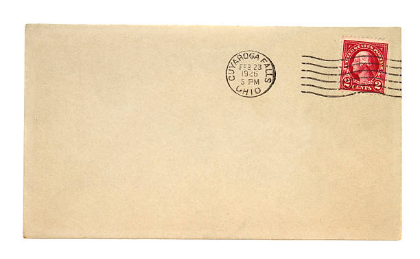 Old envelope with 1926 Cuyaroga Falls Ohio postmark "Old envelope with a 1926 Cuyaroga Falls, Ohio, USA  postmark and a  two cent, red, President Washington postage stamp. Weathered brown paper from natural aging. Postal history and ephemera. Plenty of copyspace to add address information of your choice. More envelopes:" 1926 stock pictures, royalty-free photos & images