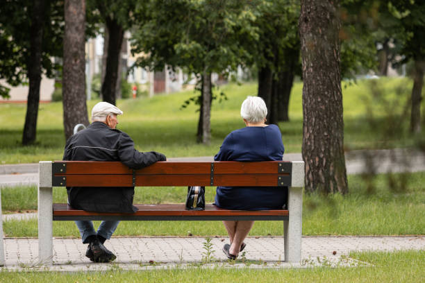 Free Stock Photo of Two People Sitting on a Bench in a Park | Download ...