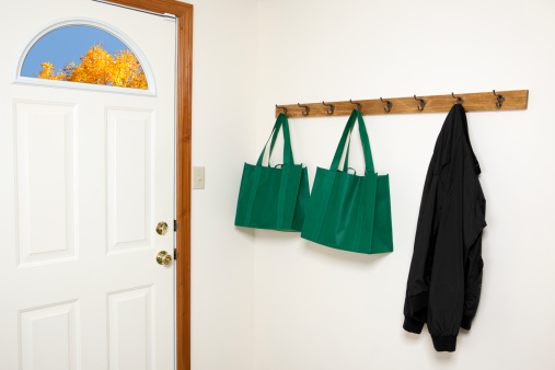 Jacket and reusable shopping bags hanging by the back door.Please also see: