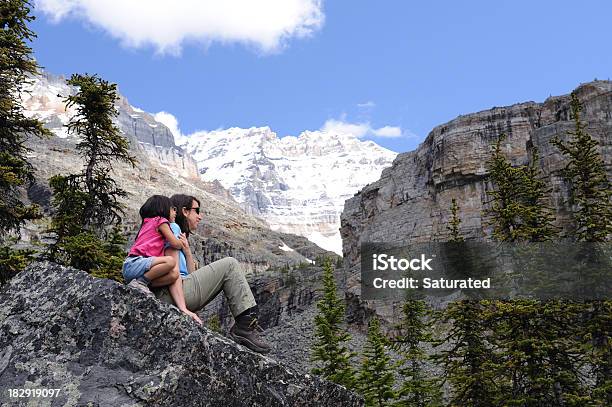 Daughter Hugging Her Mother While Relaxing In The Mountains Stock Photo - Download Image Now