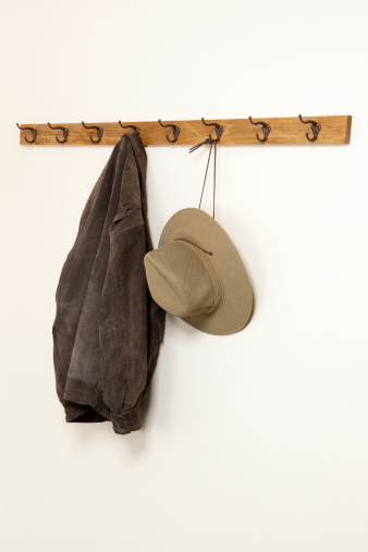 Jacket and hat hanging on a coat hook.Please also see: