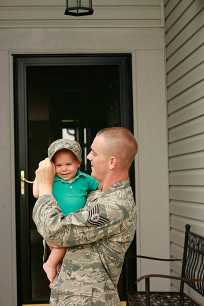 istock Military father holding his son looking happy 182919822