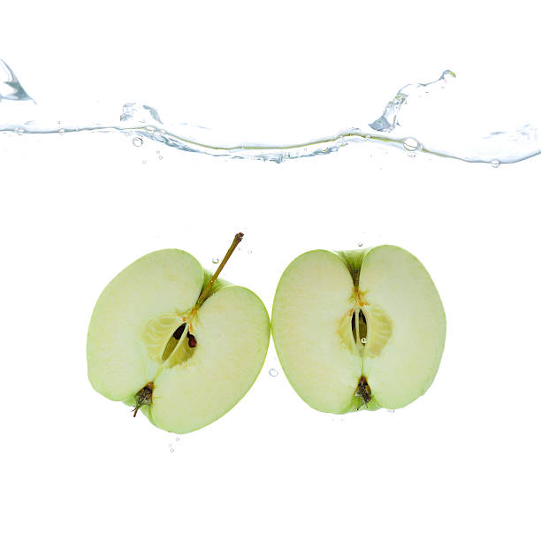 istock Two fresh green apples in water 182919961