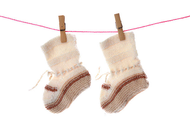 istock Baby booties hanging on the clothesline. 182920004