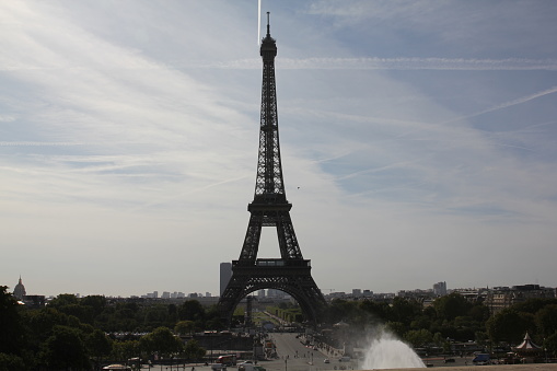 Europe, France, Paris, 2019-06, Eiffel Tower monument viewd from the Trocadero gardins. People bathing in the fountains in an effort to cool down during the heatwave.