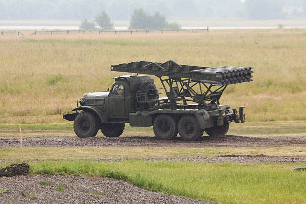 Katyusha multiple rocket launchers (Russian: Катюша) are a type of rocket artillery first built and fielded by the Soviet Union in World War II. Compared to other artillery, these multiple rocket launchers  deliver a devastating amount of explosives to an area target quickly, but with lower accuracy and requiring a longer time to reload. They are fragile compared to artillery guns, but inexpensive and easy to produce. Katyushas of World War II, the first self-propelled artillery mass-produced by the Soviet Union, were usually mounted on trucks. This mobility gave Katyushas (and other self-propelled artillery) another advantage: being able to deliver a large blow all at once, and then move before being located and attacked with counter-battery fire.