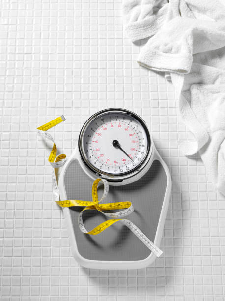 istock Tape Measure and Bathroom Weighing Scales 182920307