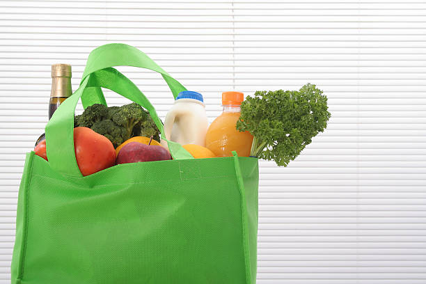 エコフレンドリーなショッピングバッグ - shopping bag orange bag handle ストックフォトと画像