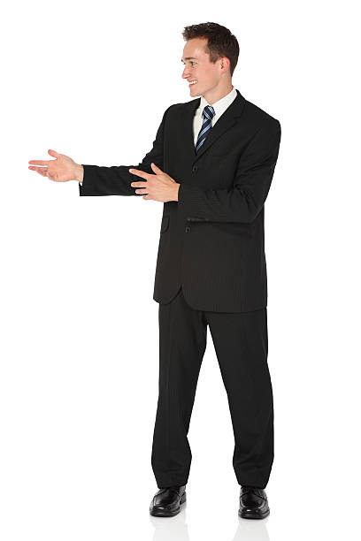istock Businessman standing and smiling 182920964