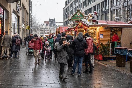 Leipzig, December 3, 2023.
Leipzig's main Christmas market is located on MarktPlatz in the old town. It is also considered the second oldest Christmas market in Germany, having been held since 1458.
Lipzig main street with people eating during the Christmas market.