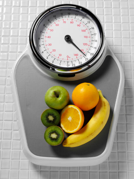 istock Healthy Fruit on Bathroom Scales 182921803