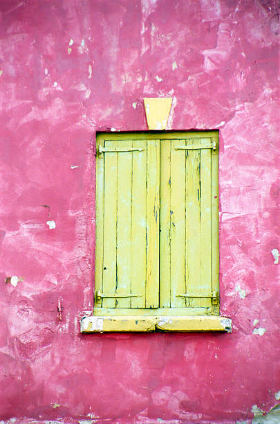 istock Yellow closed window on pink wall. 182922523
