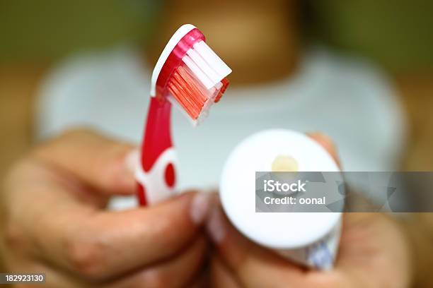 A Closeup Of A Toothbrush Head And Open Toothpaste Tube Stock Photo - Download Image Now