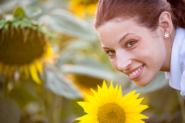 istock Woman with sunflower 182923375