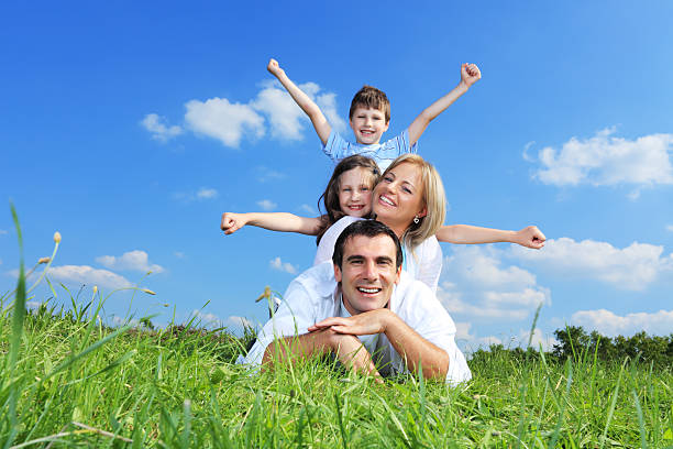 istock Beautiful happy family lying down one on another. 182923409