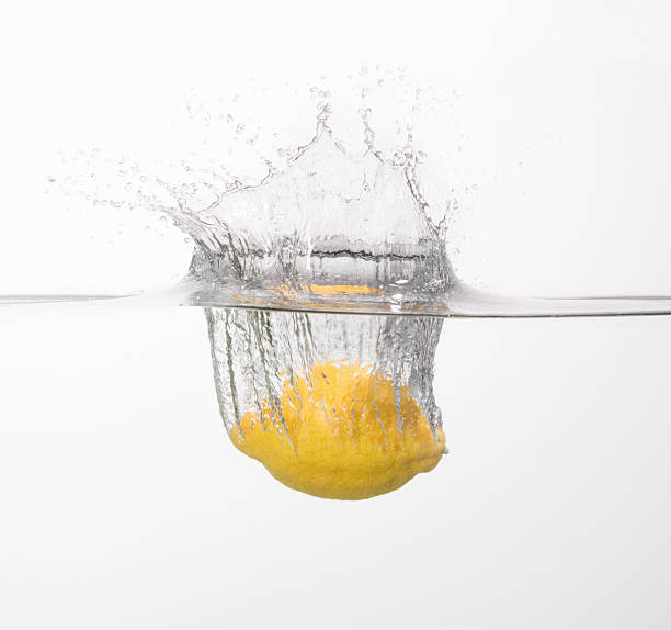 Lemon splashing into the water
