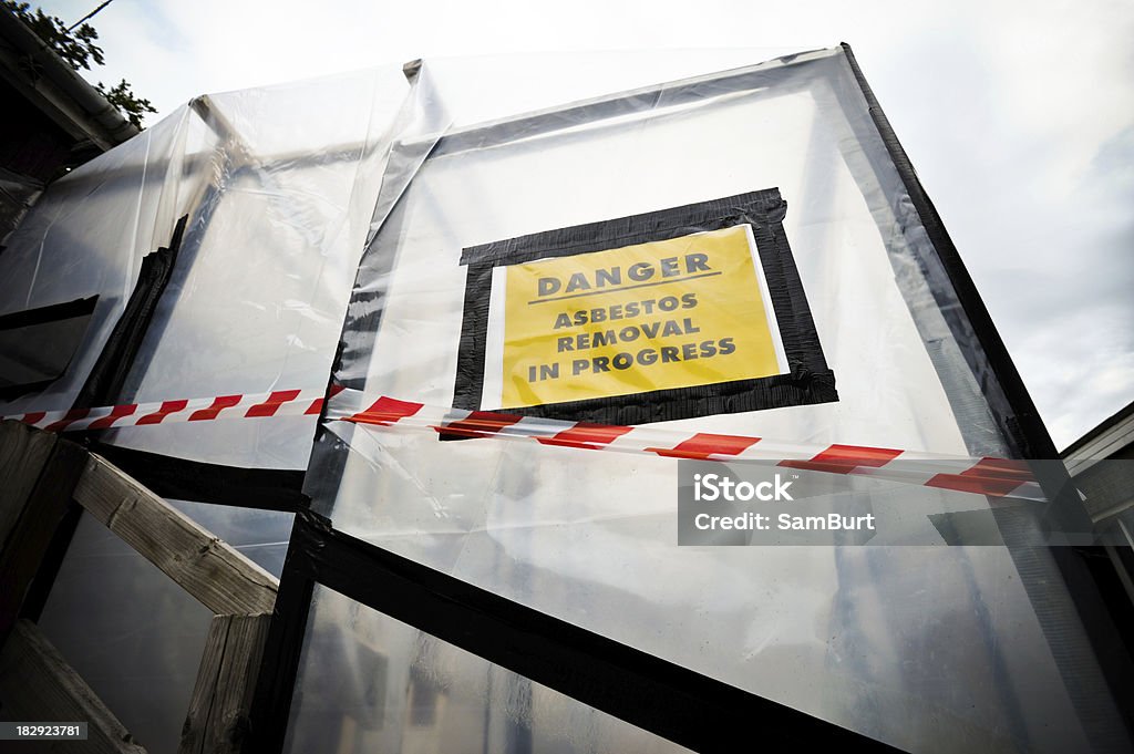 Asbestos Removal A plastic covered entrance to building undergoing an asbestos removal process. Asbestos Stock Photo