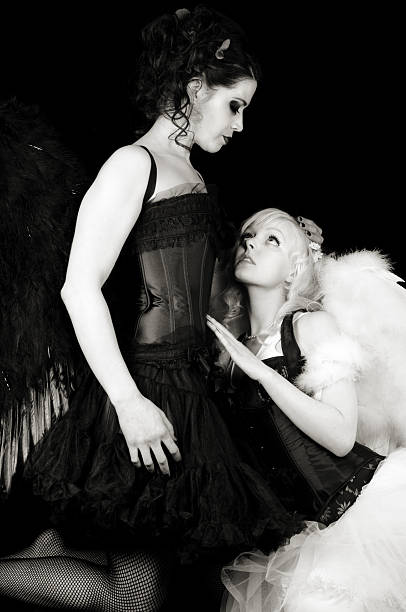 istock Angel pleads with demon, B&W 182924118