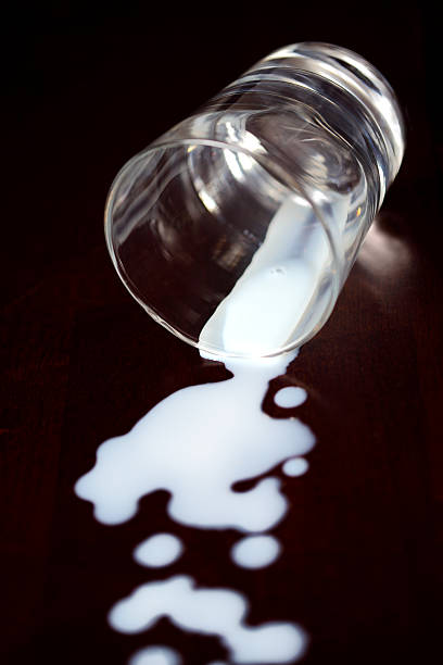 istock Glass on its side with milk spilled out 182924248