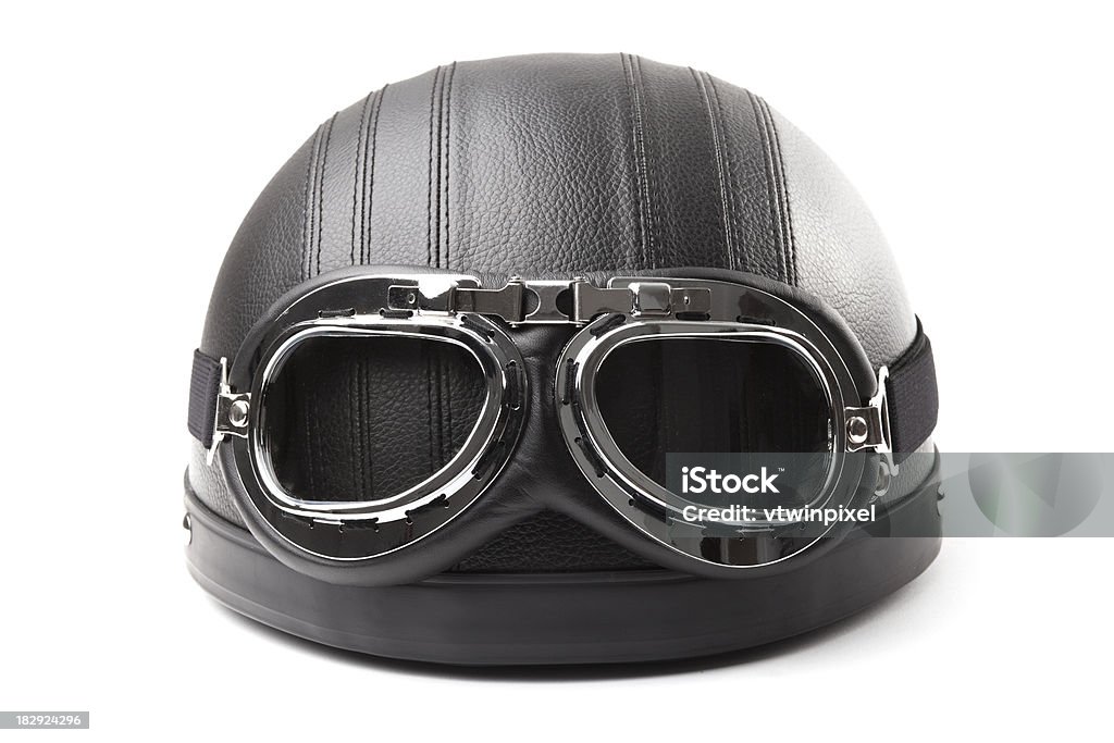 Vintage Motorcycle helmet Vintage leather motorcycle helmet with aviation goggles isolated on white background. Front View Stock Photo