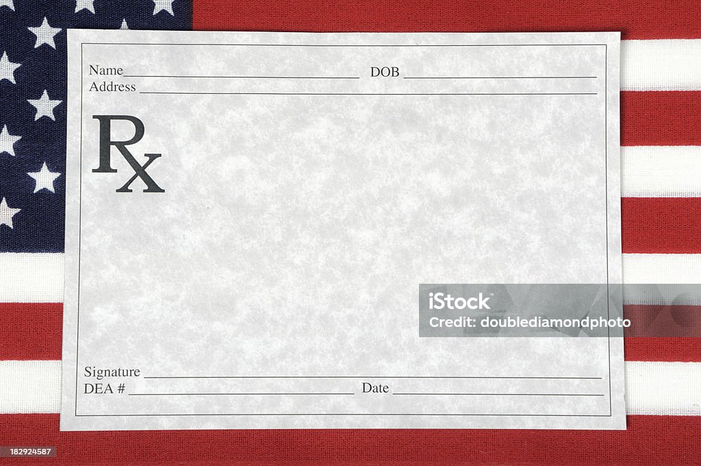 US Health Care A blank prescription form sitting on an American flag American Flag Stock Photo