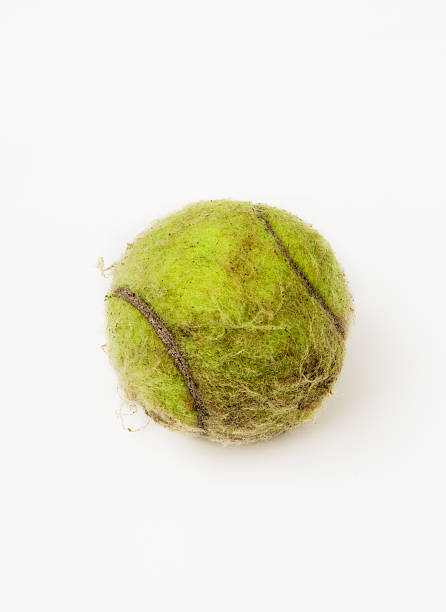 tennis ball old and dirty still life stock photo