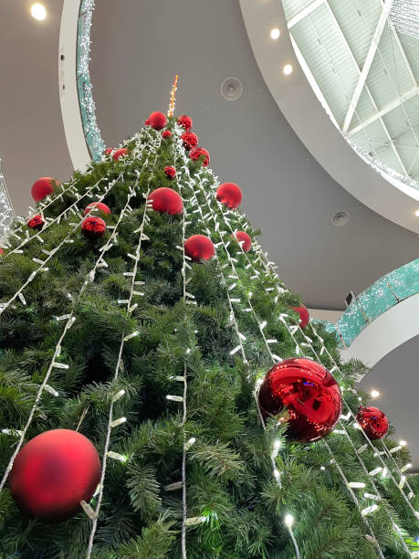 istock a big christmas tree inside a shopping mall seen from below in perspective 1829257443