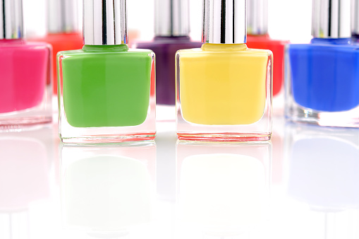Colorful nail polish bottles - selective focus