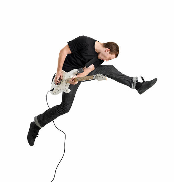 joven tocando la guitarra - isolated on white studio shot guitar young men fotografías e imágenes de stock