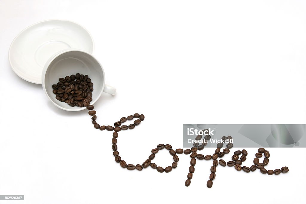 Coffee out of the cup Out of a cup of coffee driping coffee beans spelling the word coffee. Studio shot isolated on white Advertisement Stock Photo