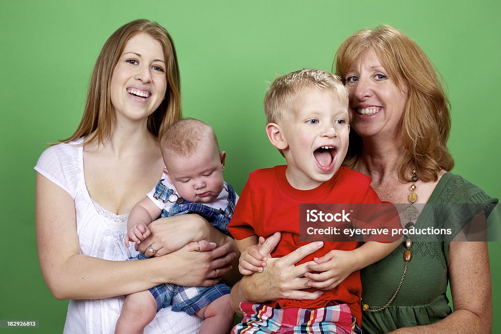 mother infant grandmother toddler family young mother with infant boy child and grandmother with toddler (photos professionally retouched - Aperture/Photoshop - studio light) Adult Stock Photo