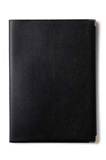 istock Isolated shot of black notebook on white background 182926845