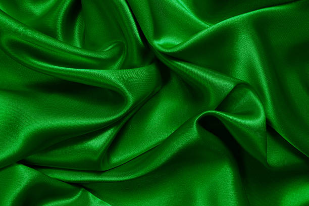 istock Crumpled up green satin fabric  182927008