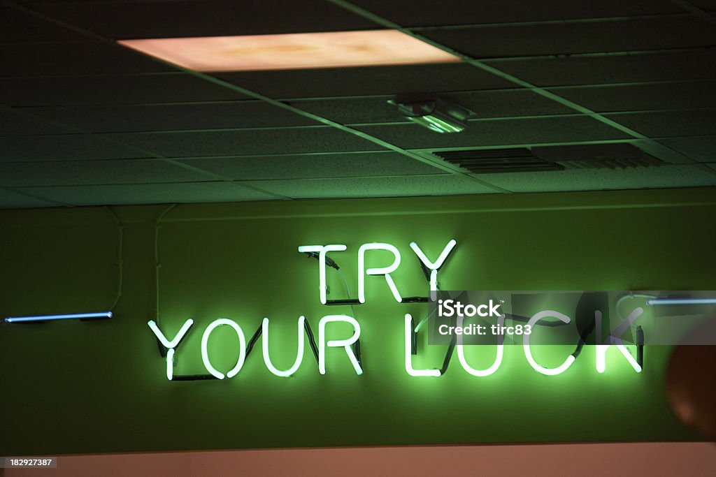 Neon sign showing try your luck Amusement Arcade Stock Photo