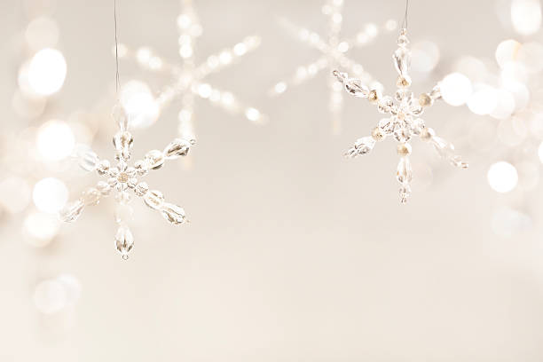 Tan Christmas background with large crystal snowflakes