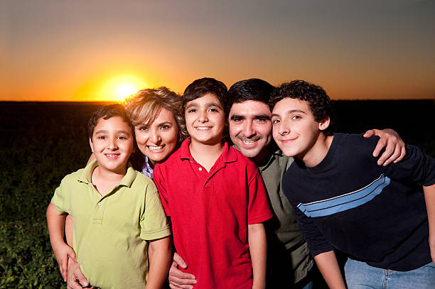 Happy family  enjoying together in a park-