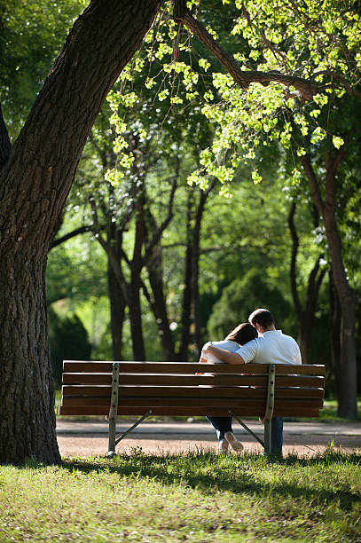 istock Lovely couple sitting at the park 182928466