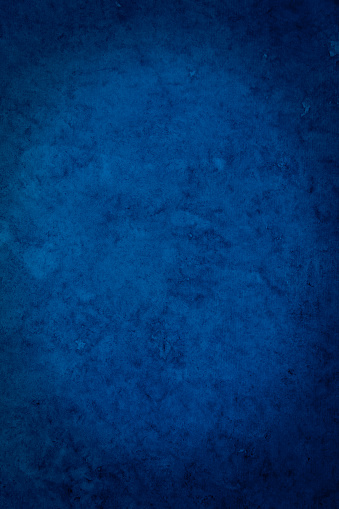 Blue textured paper background with dramatic vignette.